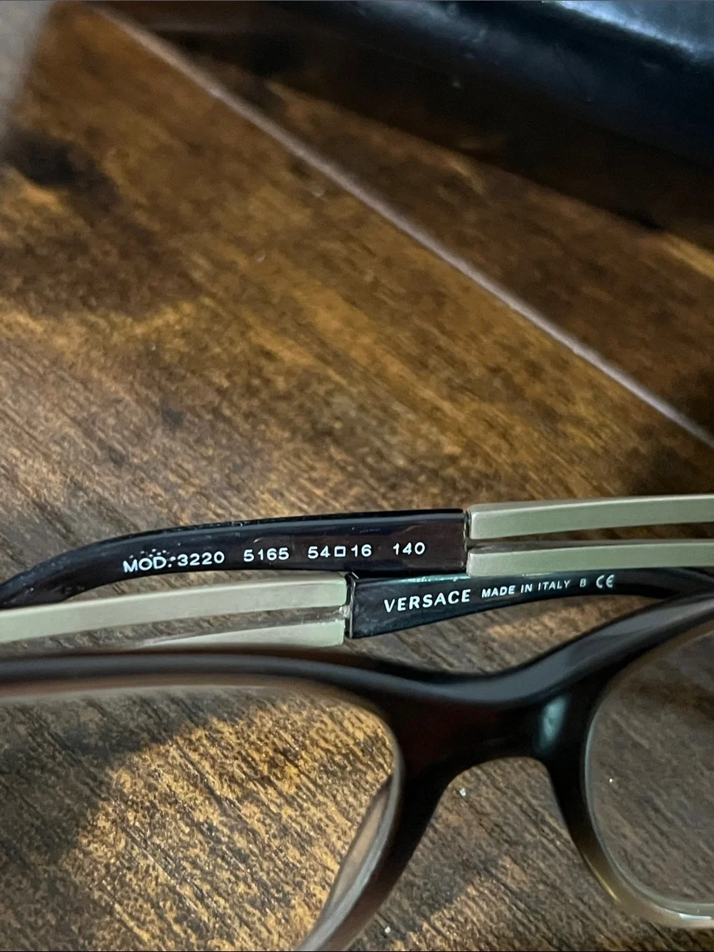 Versace Black Frame Sunglasses with Gold Temples